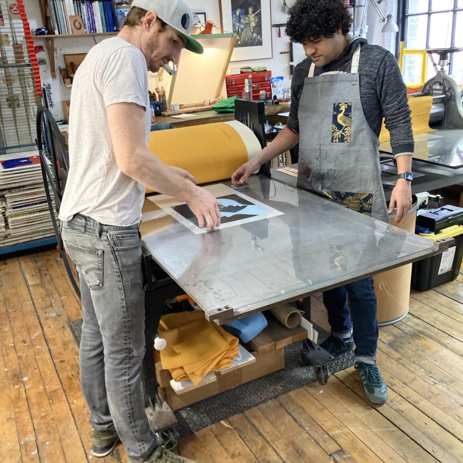 Master Printmaker, Laine Groeneweg, and artist Nathan Eugene Carson creating monoprints in Smokestack's Analog Studio, 2022