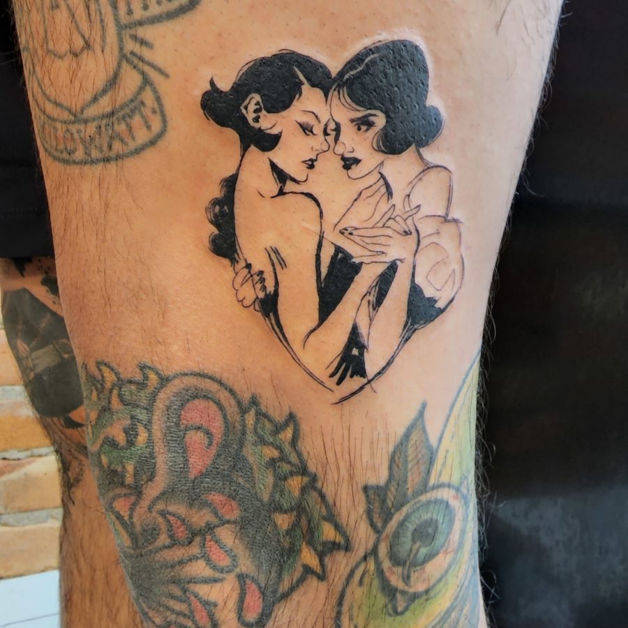 Tattoo of two women in an embrace