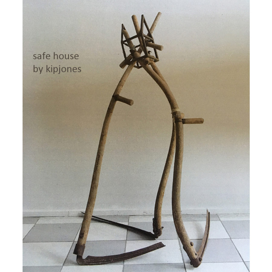 standing sculpture incorporating scythes and cast iron house frame, by kipjones