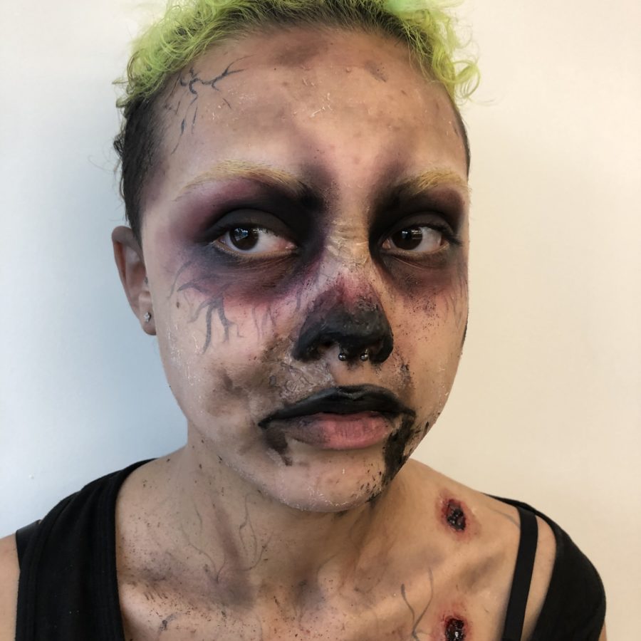 Ghoul makeup with pitch fork wound