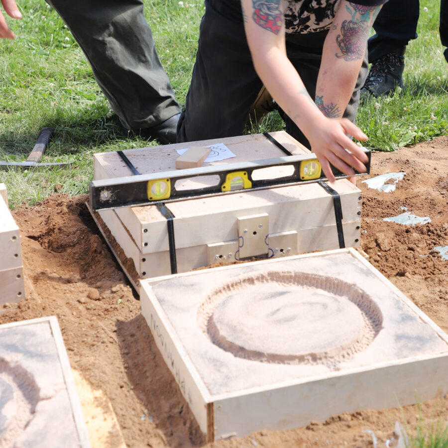 CSCIA member checking level of rectangular sand mould on the ground