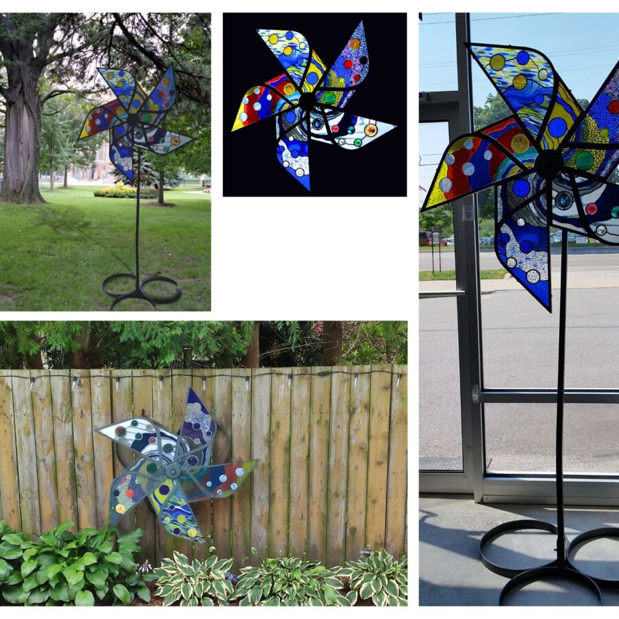 This Pinwheel was created by 5 artists including myself who were in the former glass group called A.G.O.G.  Each spoke was created by a different artist.  It is a fully rotating sculpture that stands 7 feet tall and is in private collection in Nova Scotia.